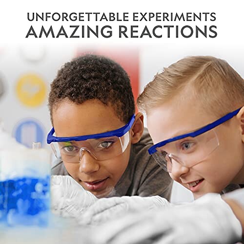 Children wearing safety goggles conducting a science experiment with blue liquid.