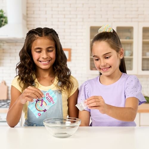 Two girls making slime in a kitchen