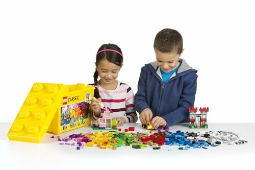 Two children building with LEGO bricks.