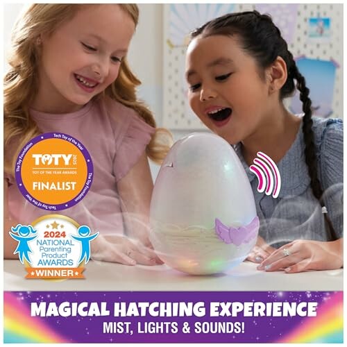 Two children excitedly watch a hatching toy egg with mist, lights, and sounds.