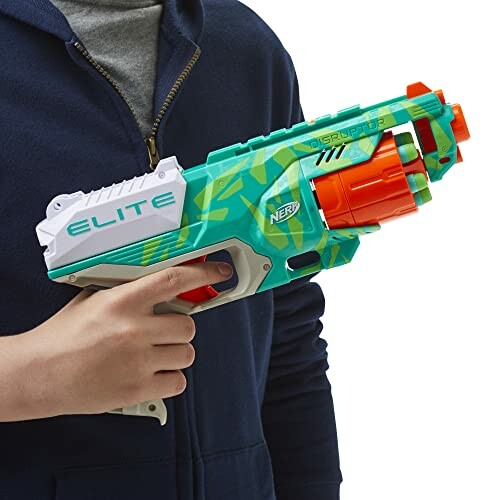 Person holding a Nerf Elite blaster toy.