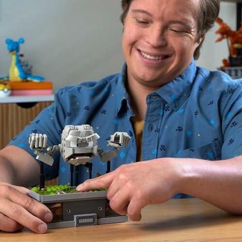 Person assembling a Lego model with a smile, showcasing the set's complexity and detail.