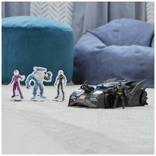 Toy figures and Batmobile on carpet.